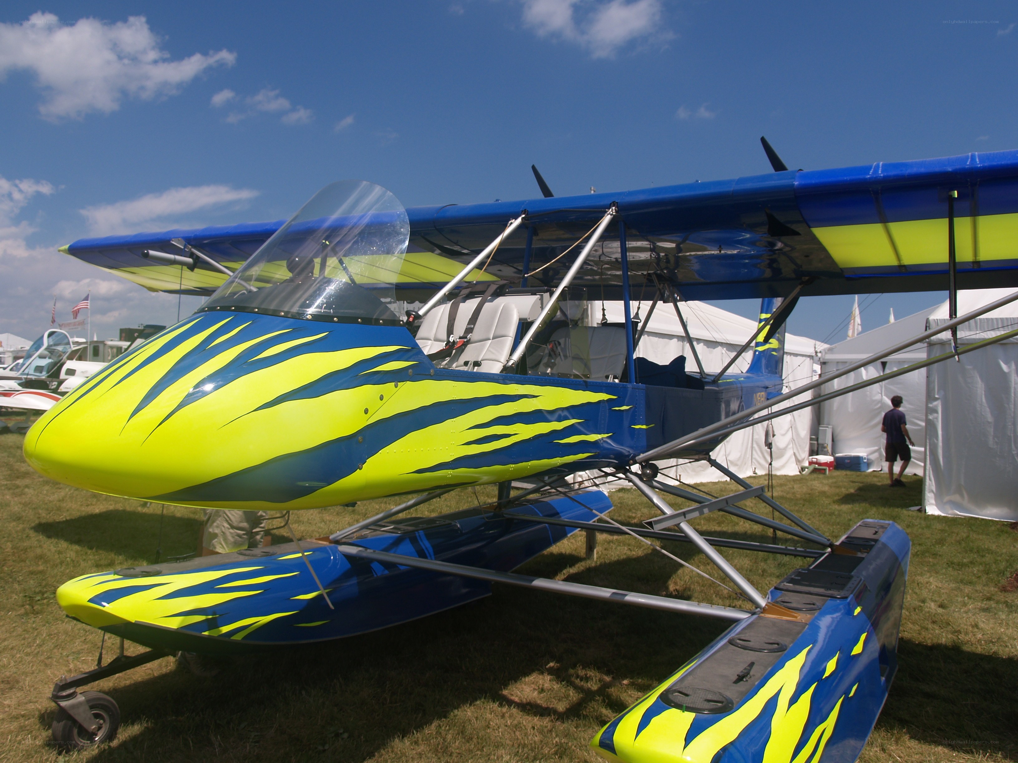 blue and yellow seaplane on display