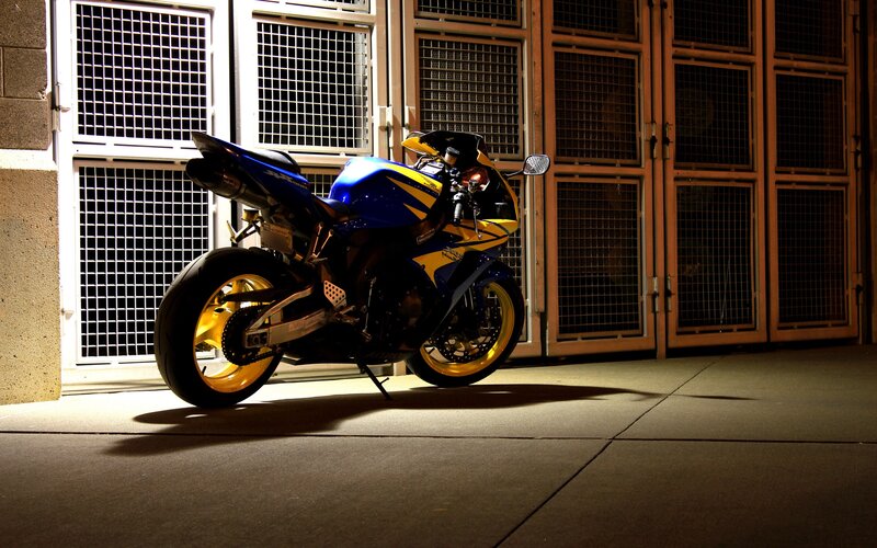 blue and yellow sport motorcycle