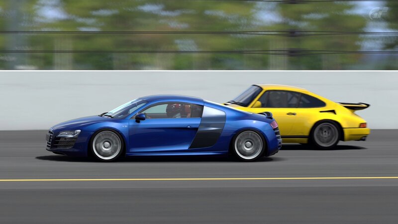 Blue and yellow sports cars racing
