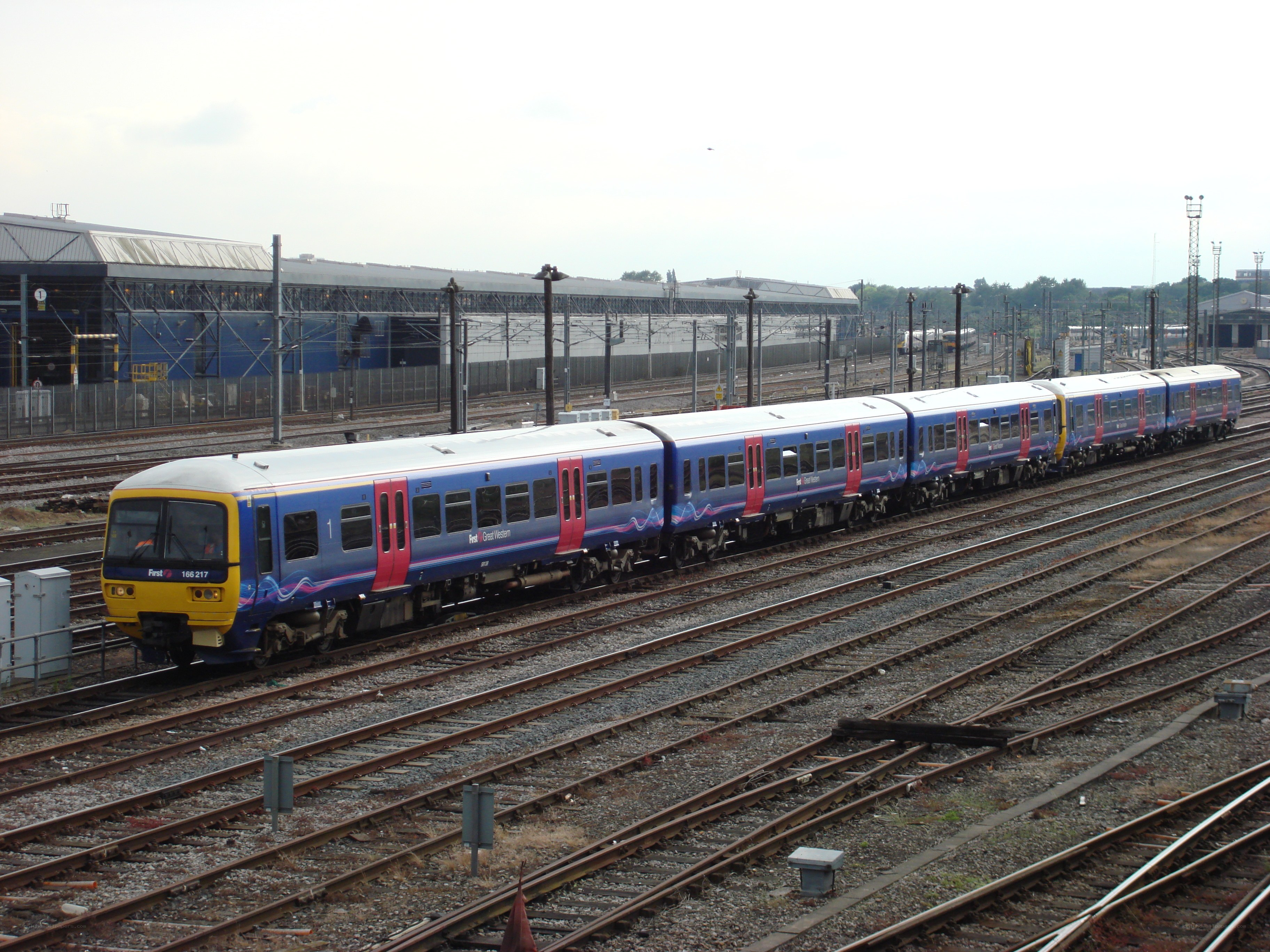 Blue and yellow train at station