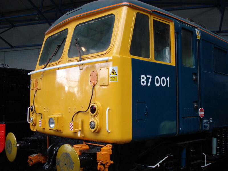 Blue and Yellow Train — Industrial, Photograph, Windows