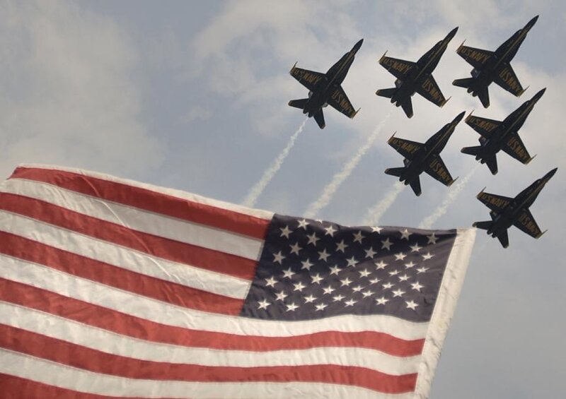Blue Angels fly over American flag
