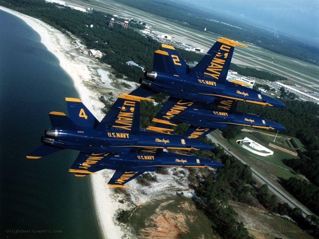 Blue Angels flying over coast