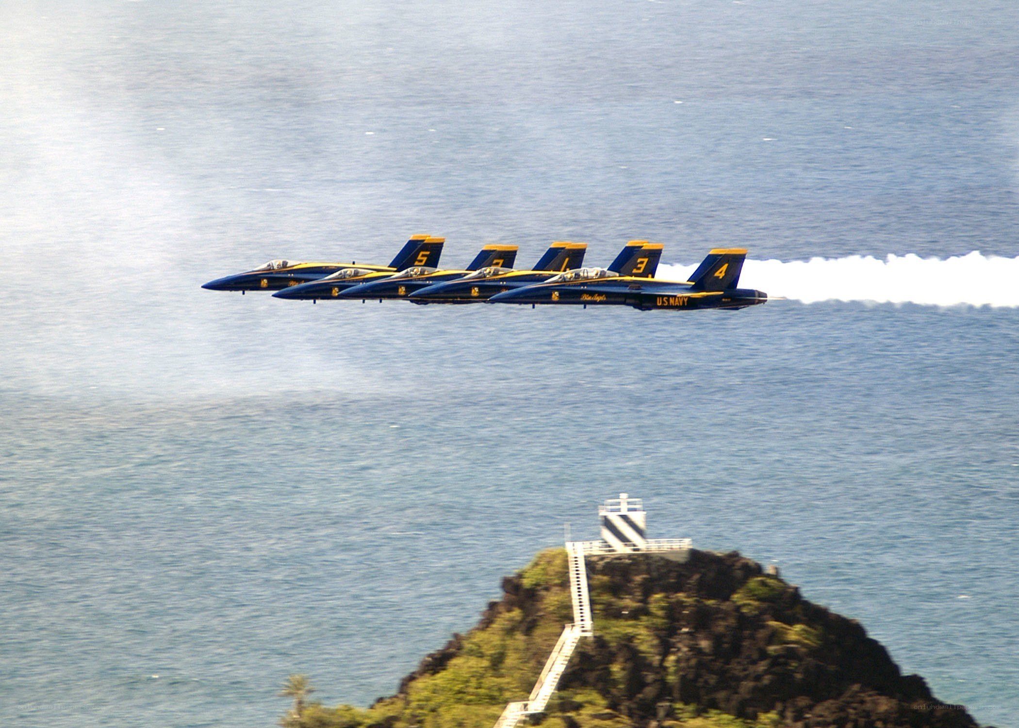 Blue Angels flying over ocean