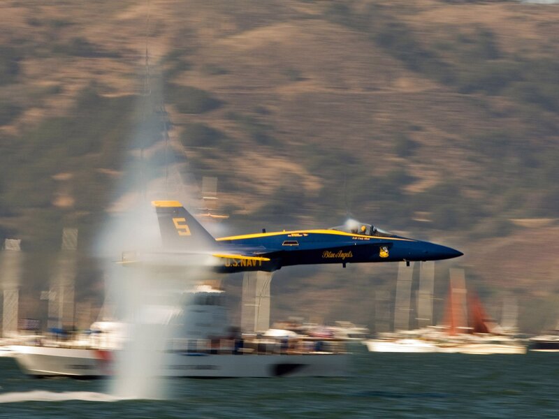 Blue Angels jet flying low over water