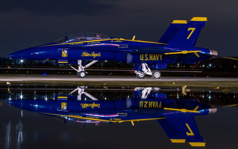 Blue Angels jet on wet tarmac