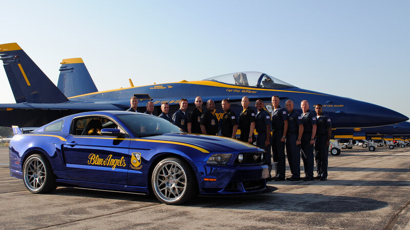 Blue Angels team with car and jet