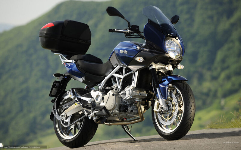 Blue Aprilia motorcycle on road