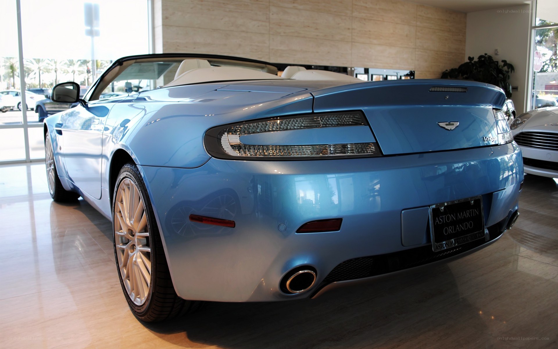 Blue Aston Martin convertible