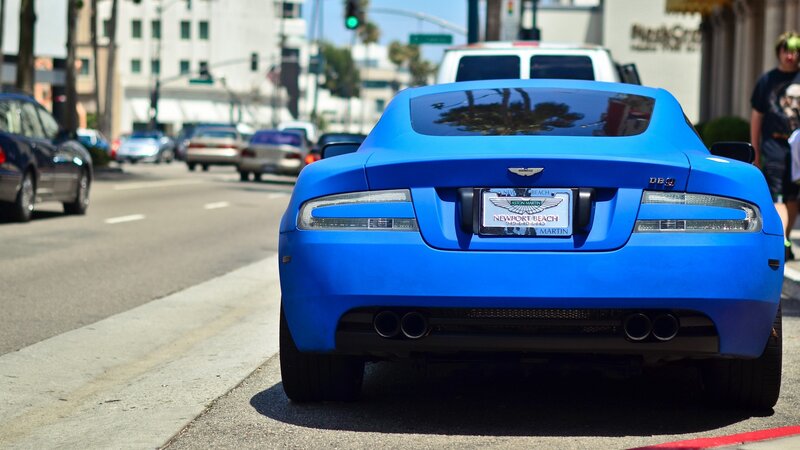 blue aston martin db9 on street