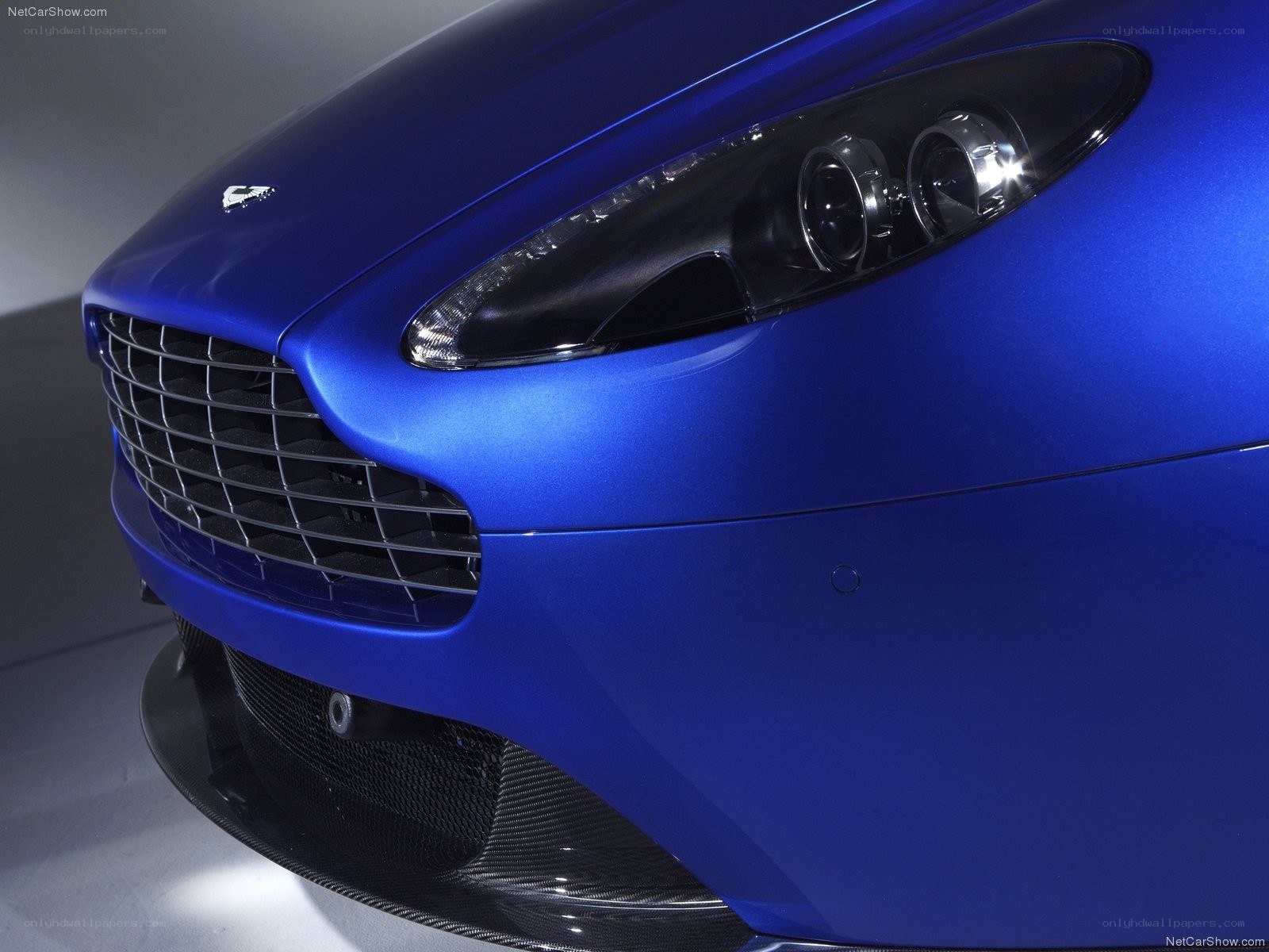 blue aston martin front view