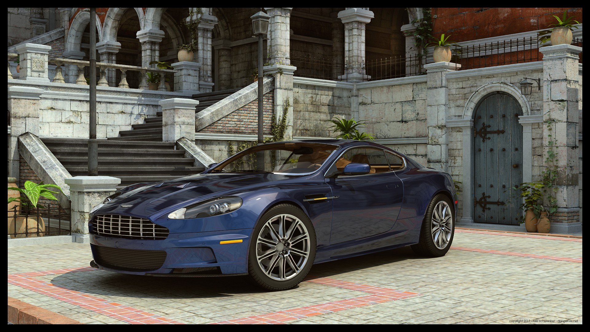 Blue Aston Martin in courtyard