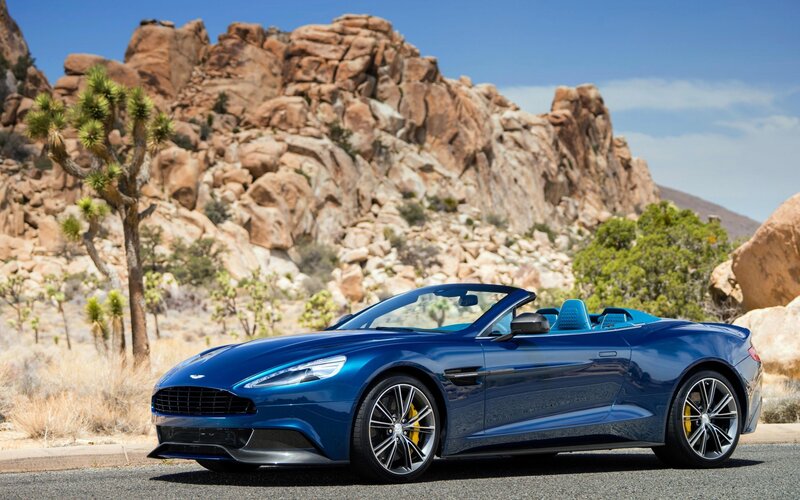 Blue Aston Martin in desert