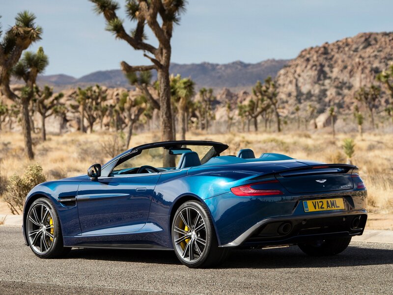 Blue Aston Martin in desert