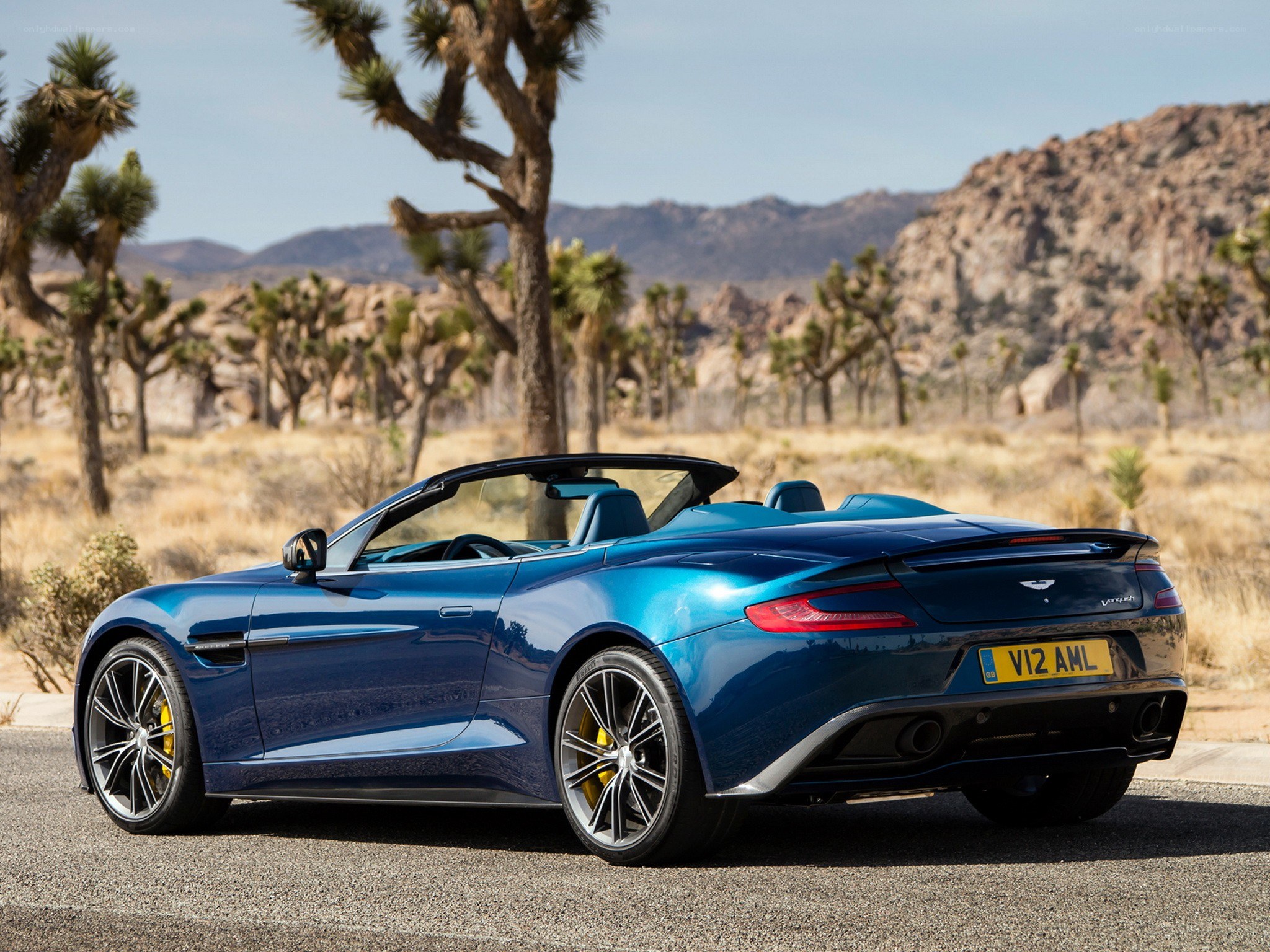 Blue Aston Martin in desert