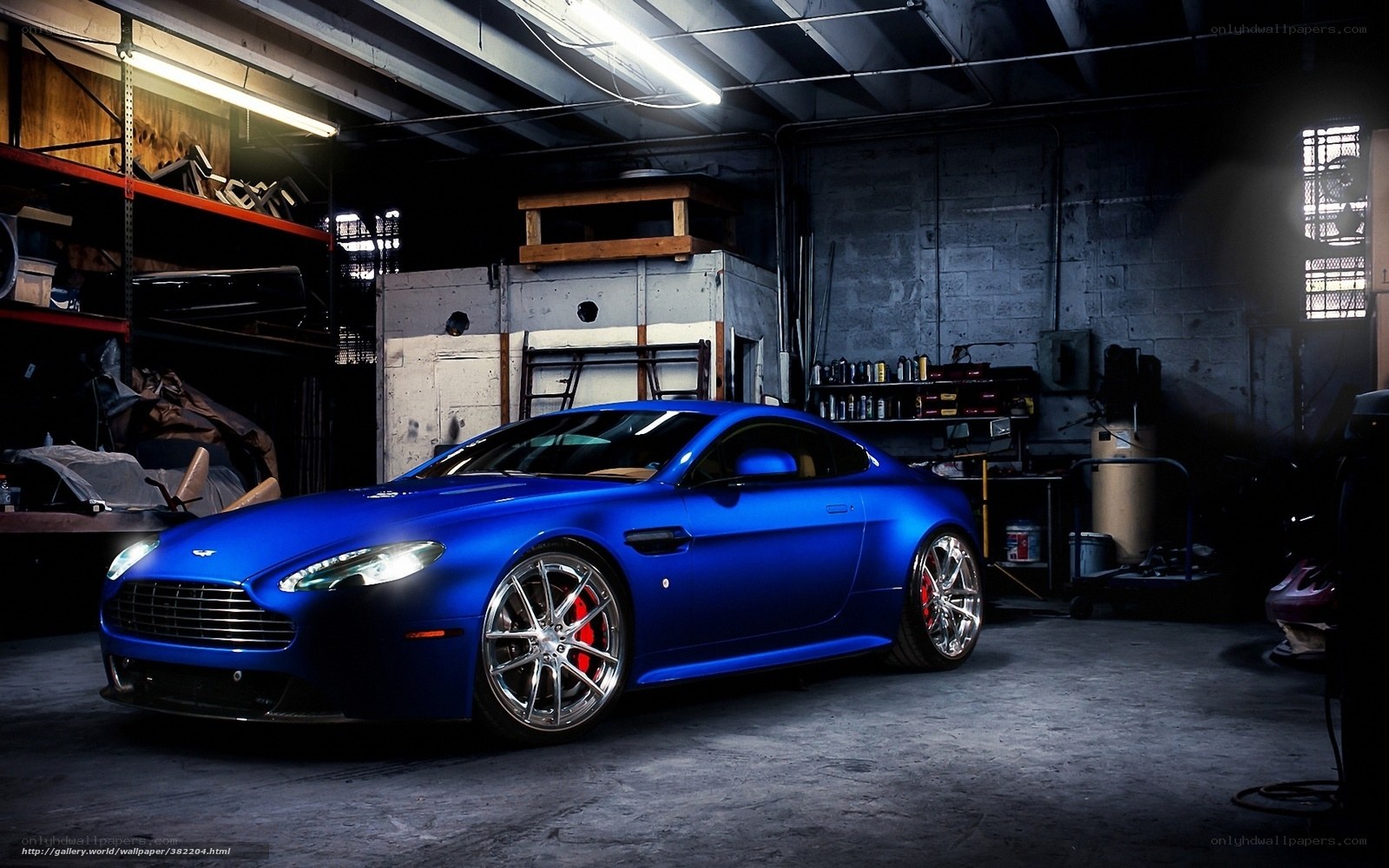 Blue Aston Martin in garage