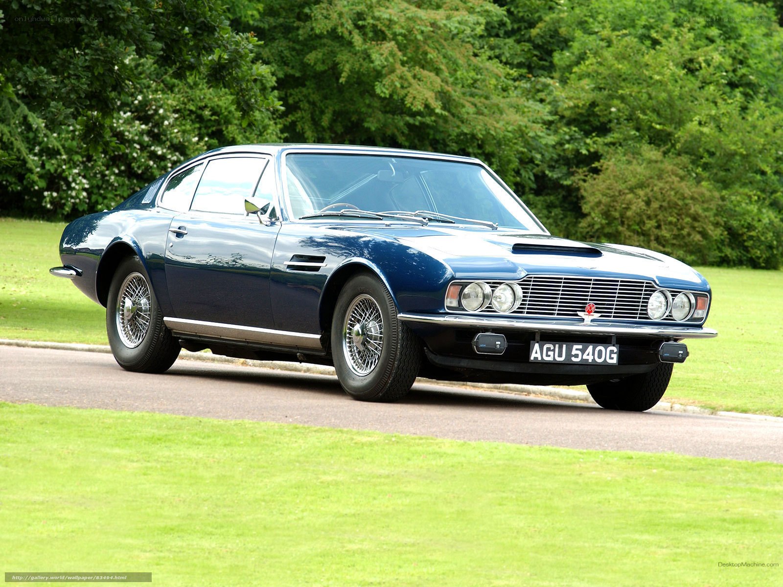 blue aston martin on a road