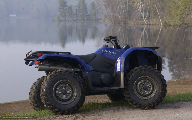Blue ATV by a lake