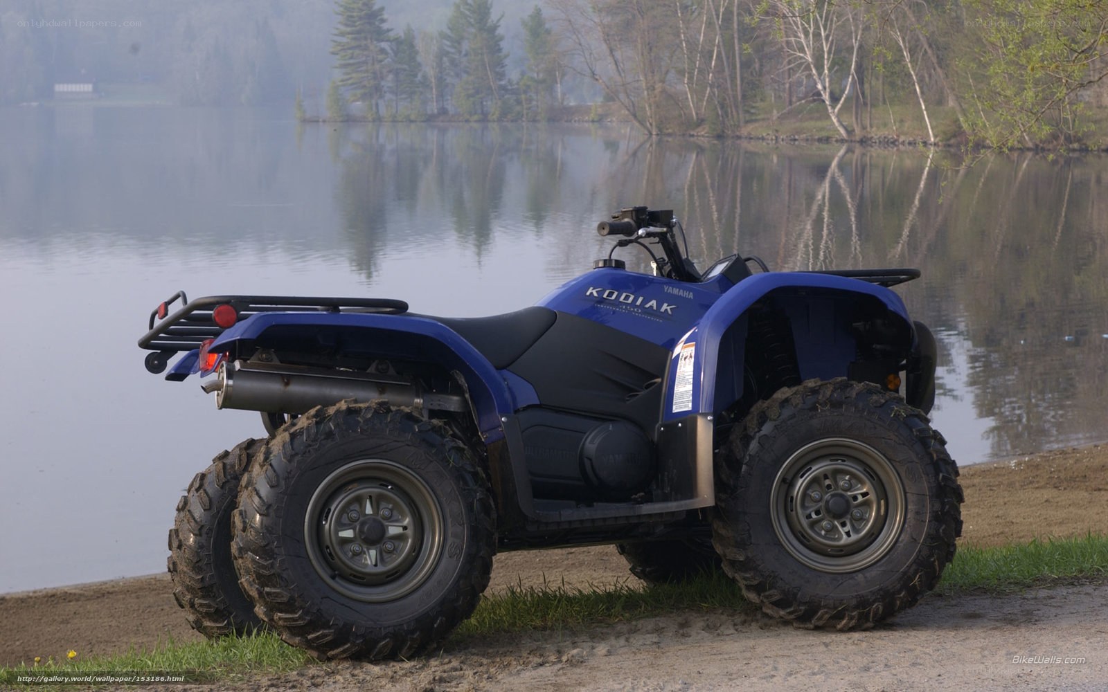 Blue ATV by a lake