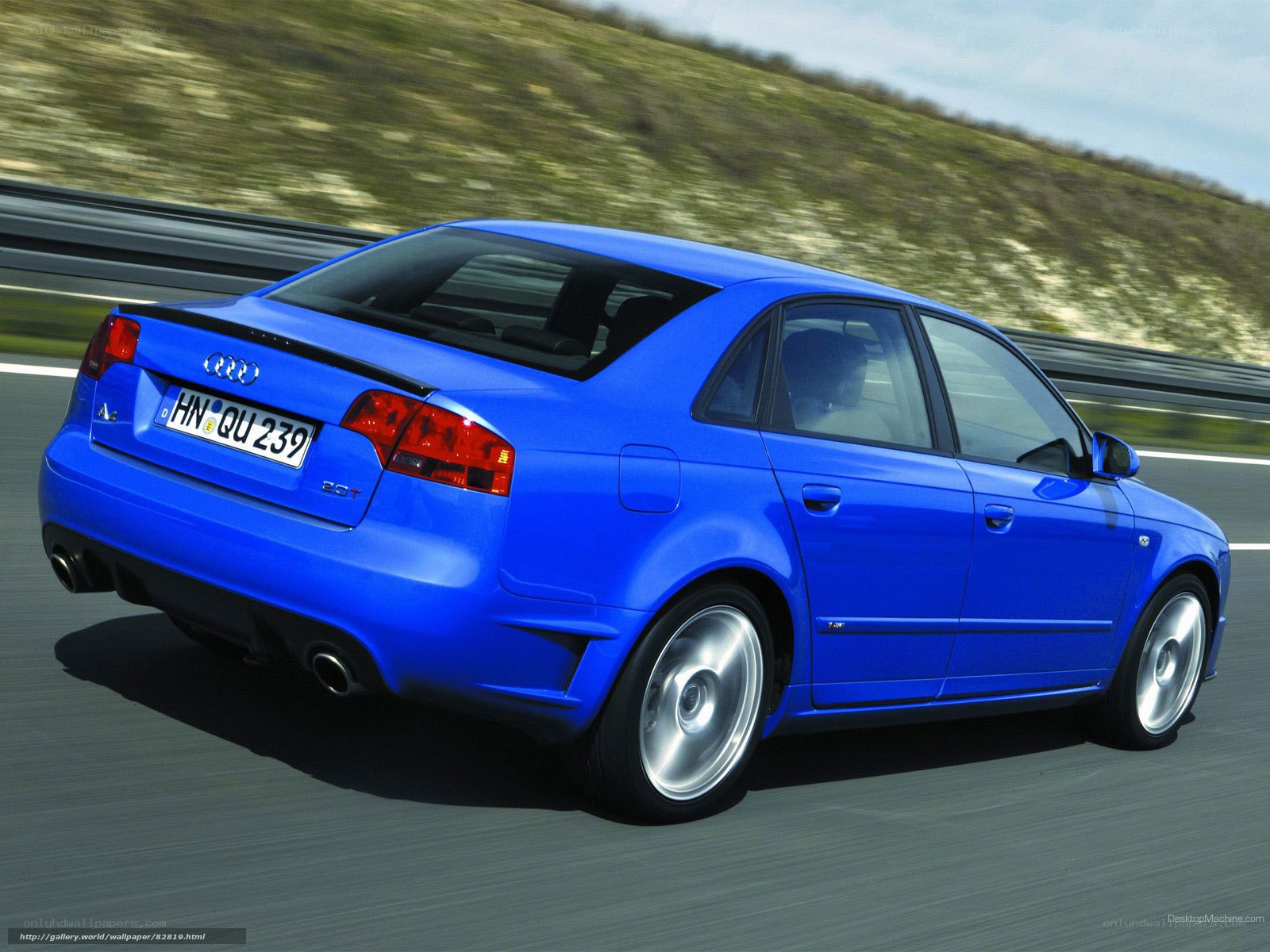blue audi a4 driving on road