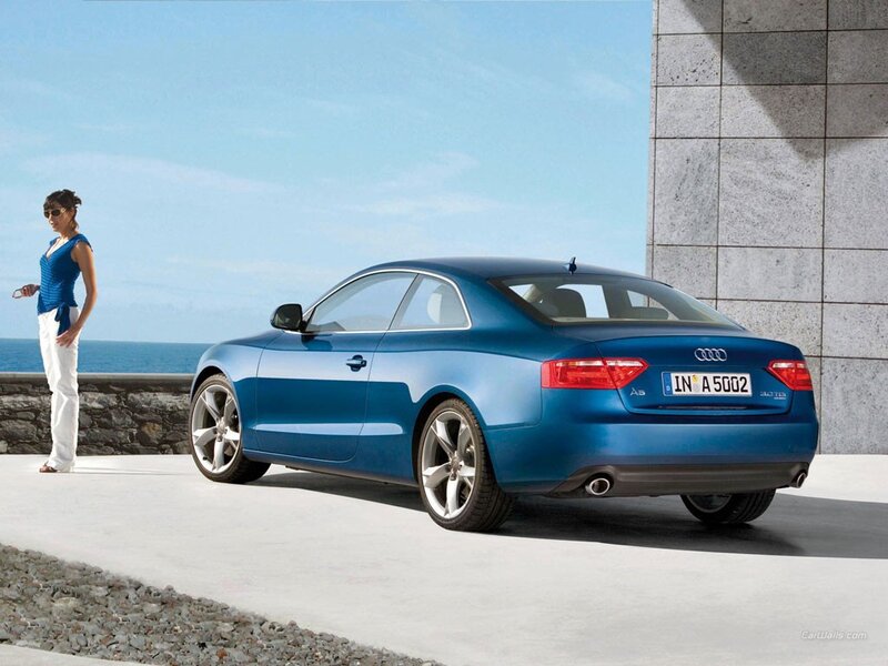 Blue Audi A5 by the sea
