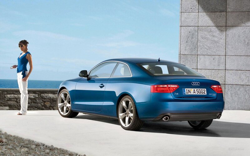 Blue Audi A5 by the sea