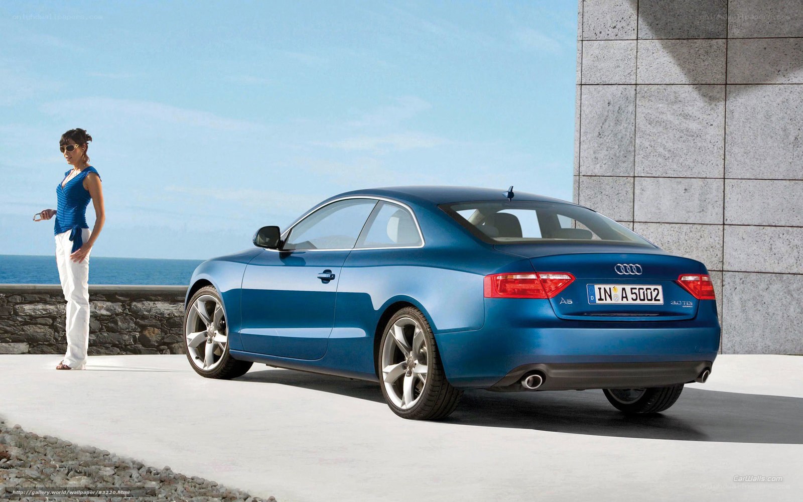 Blue Audi A5 by the sea