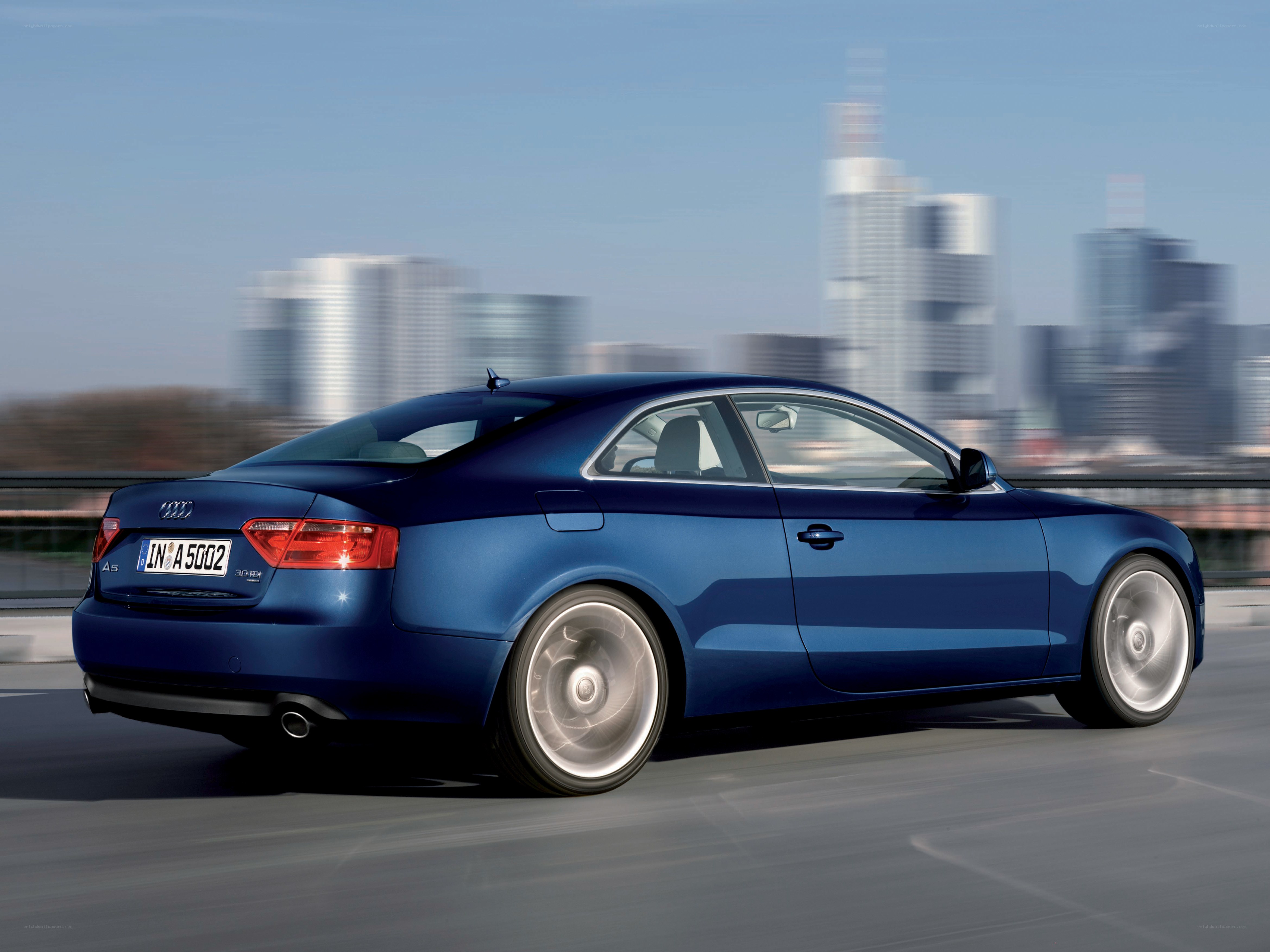 blue audi a5 in motion