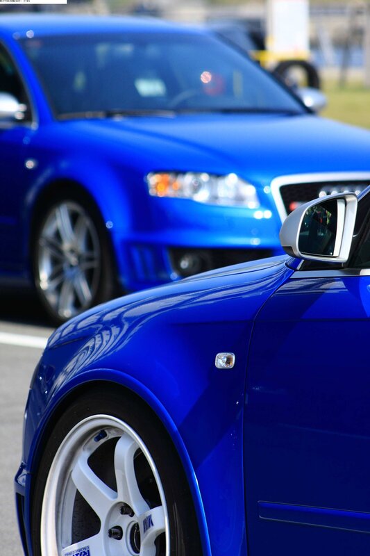 Blue Audi cars at a show