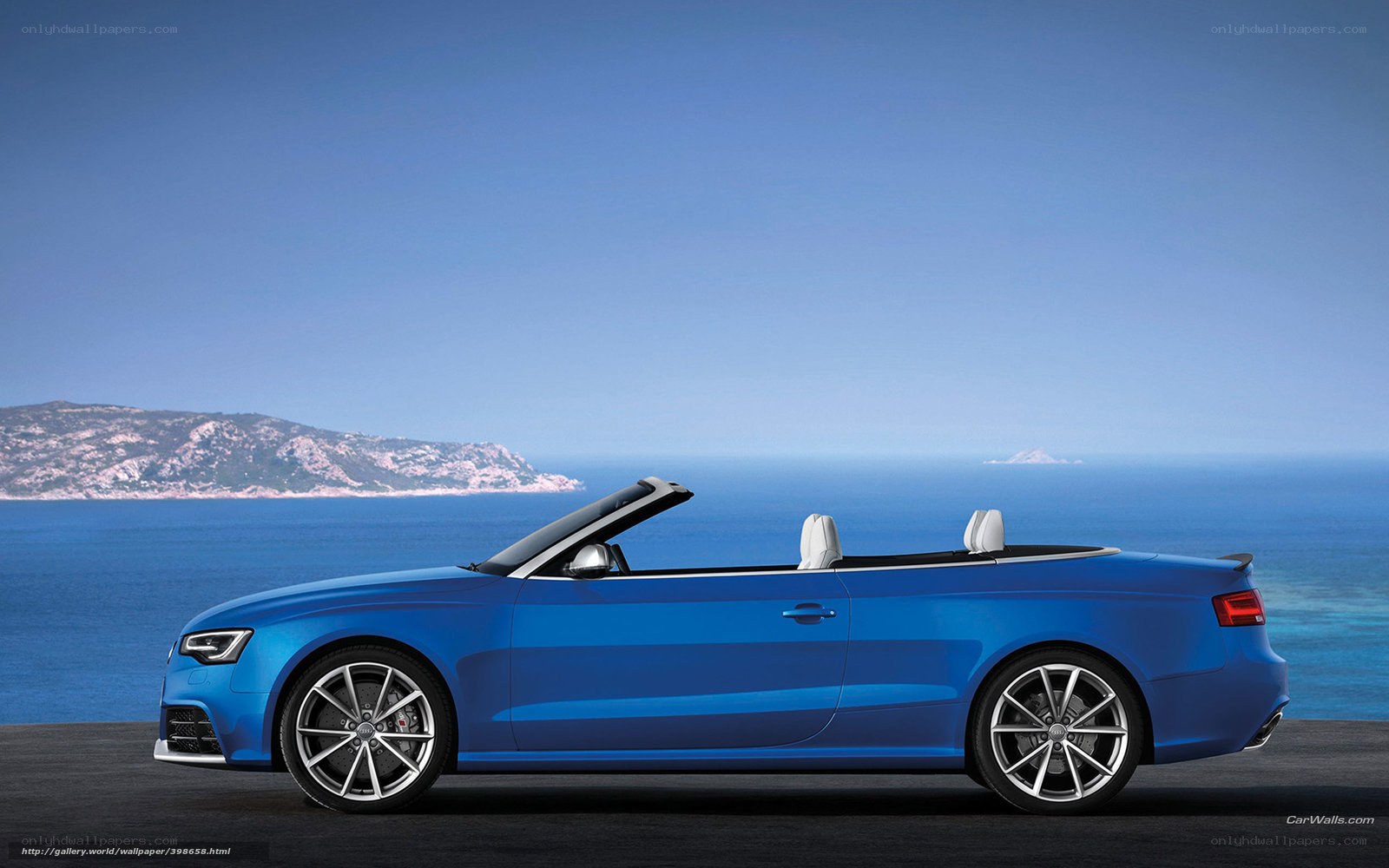Blue Audi convertible by the sea