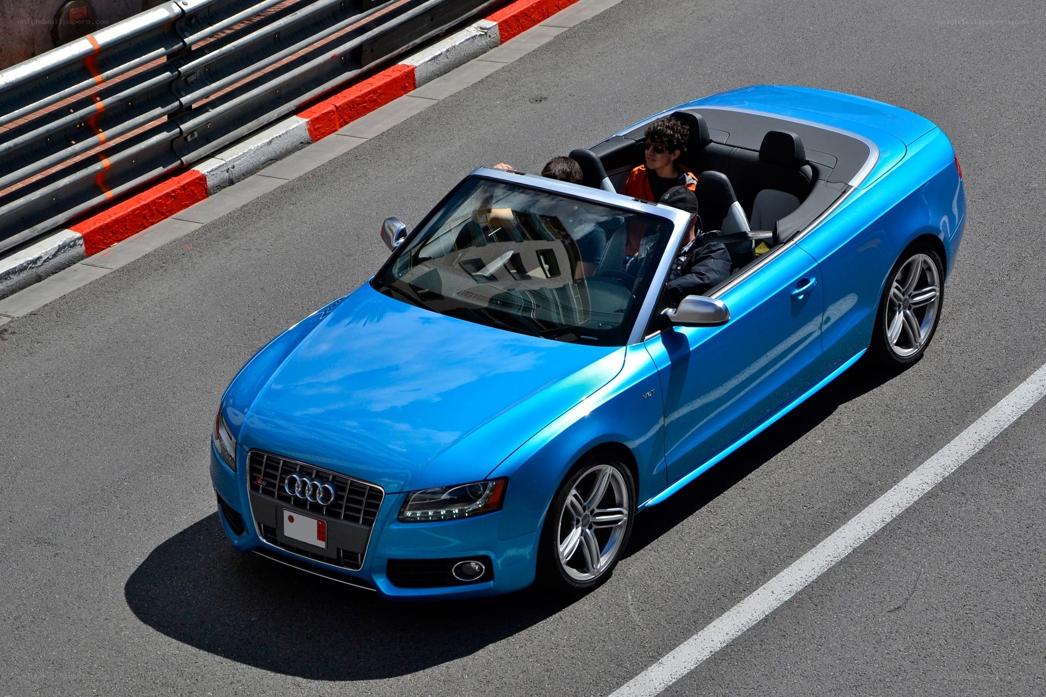 Blue Audi convertible on track