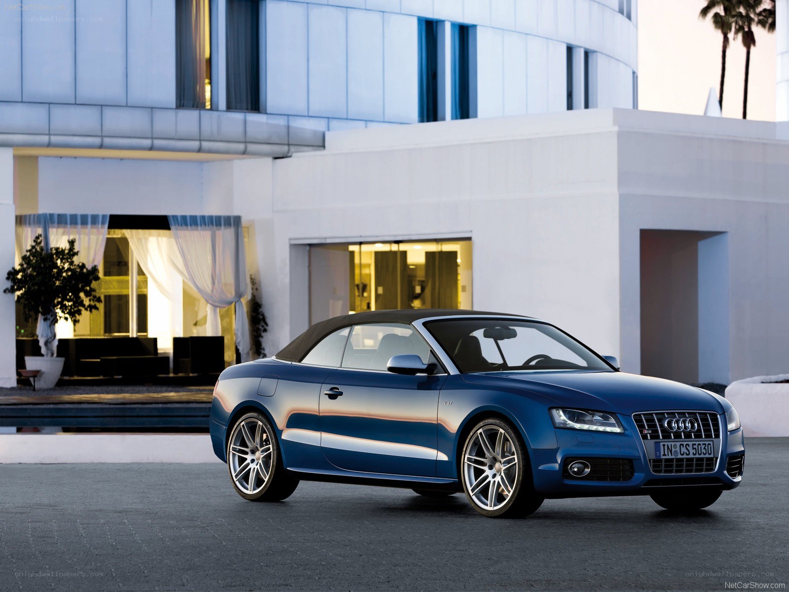 Blue Audi convertible parked outside