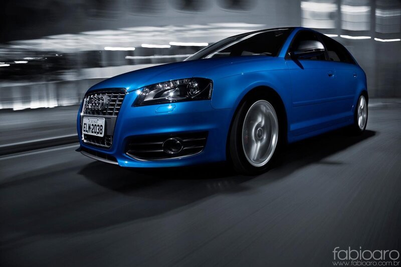 blue audi in motion