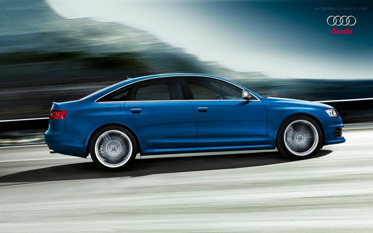 blue audi in motion