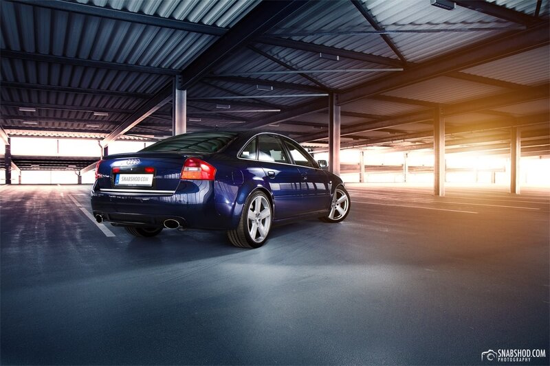 blue audi in parking garage