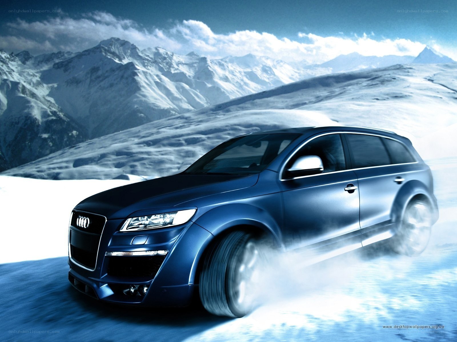 Blue Audi in snowy mountains