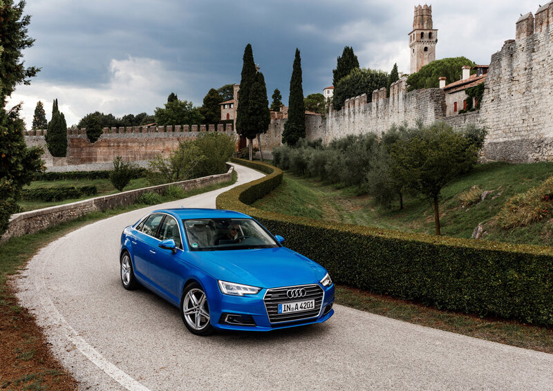 Blue Audi on a winding road