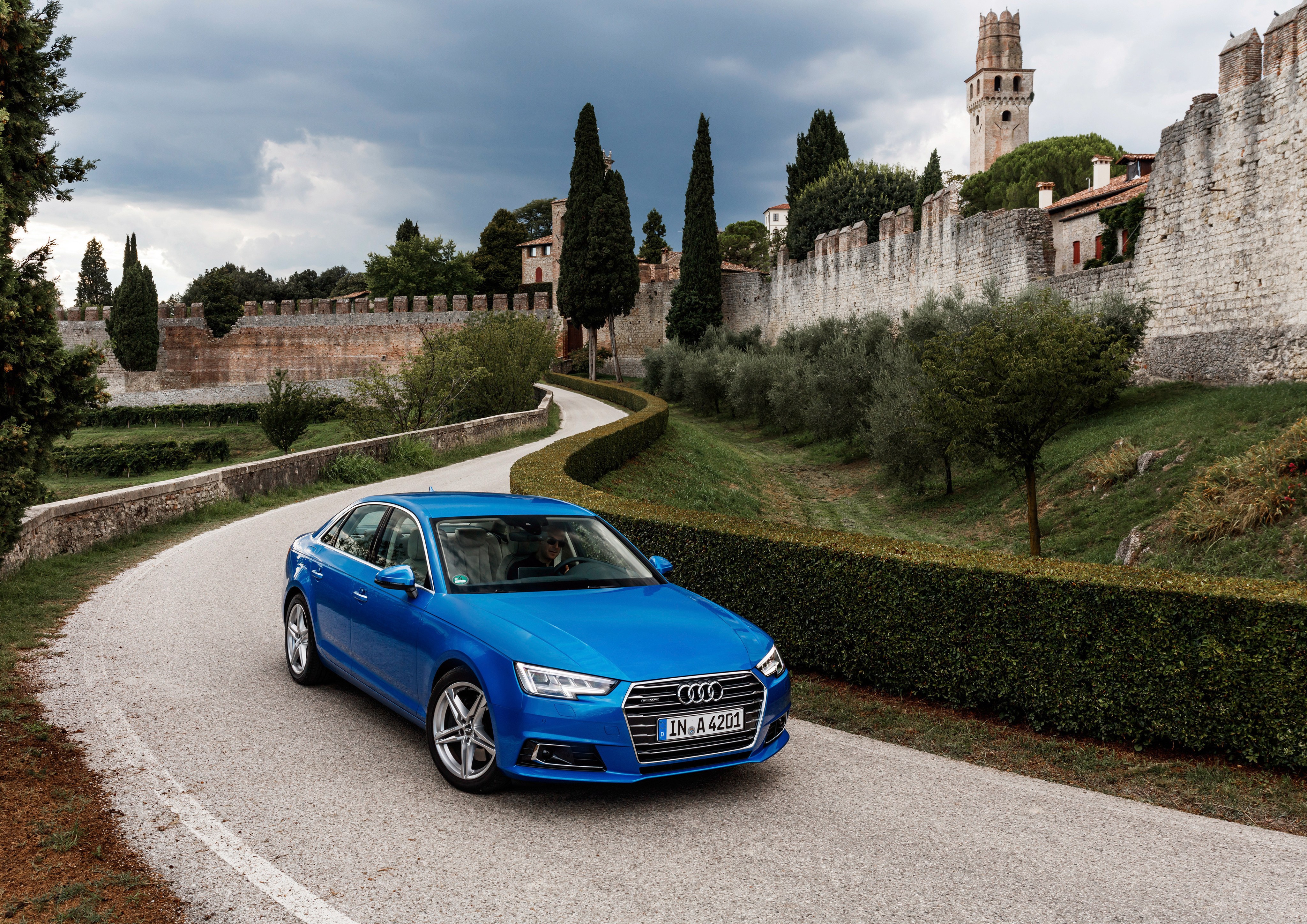 Blue Audi on a winding road