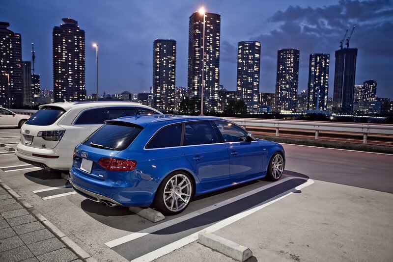 Blue Audi parked at night