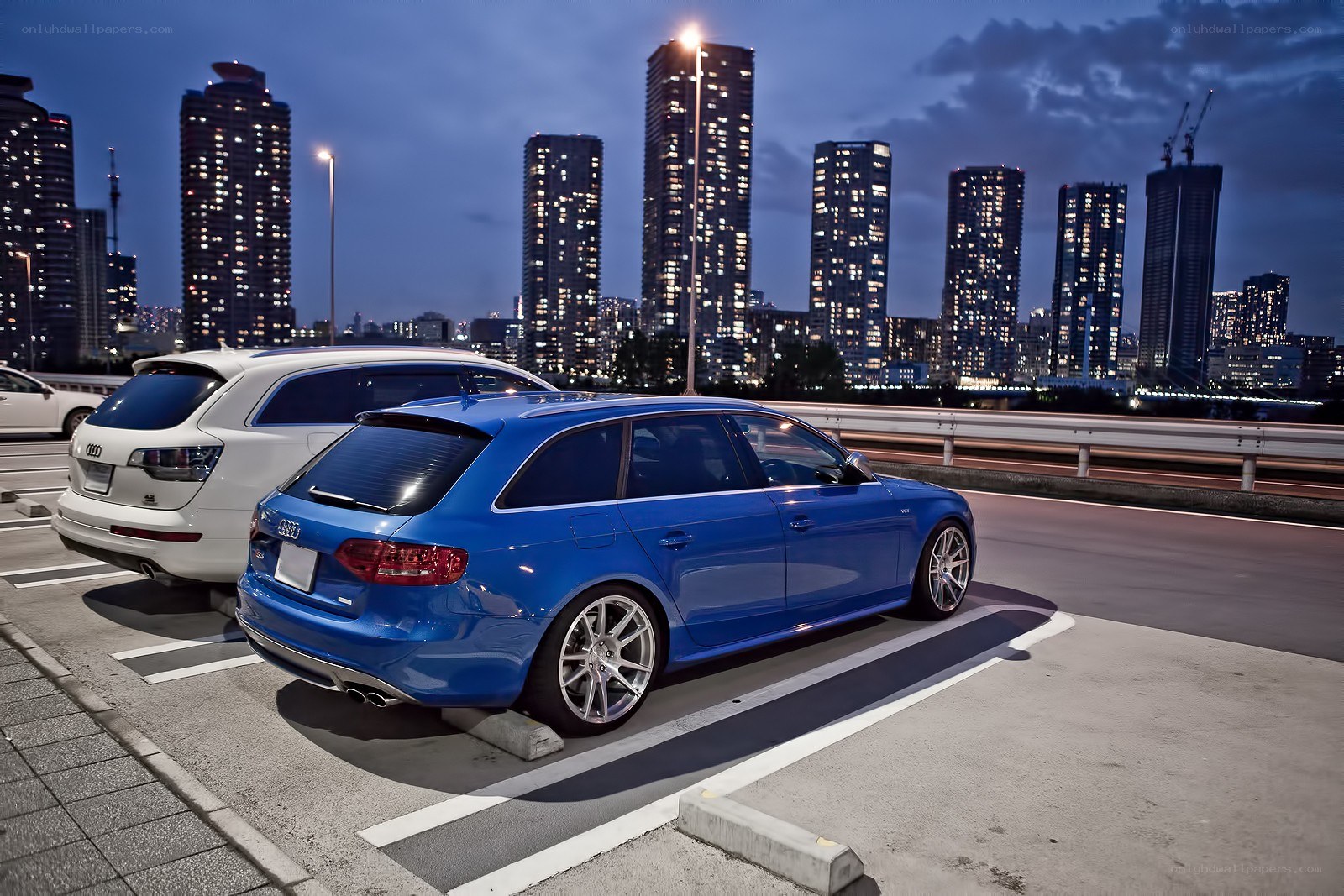 Blue Audi parked at night