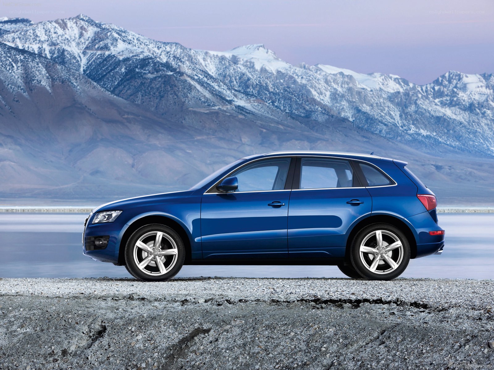 Blue Audi Q5 by mountains