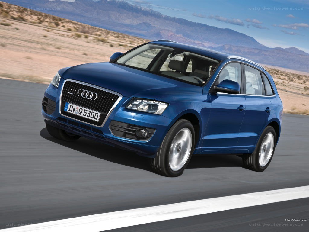 blue audi q5 driving on road