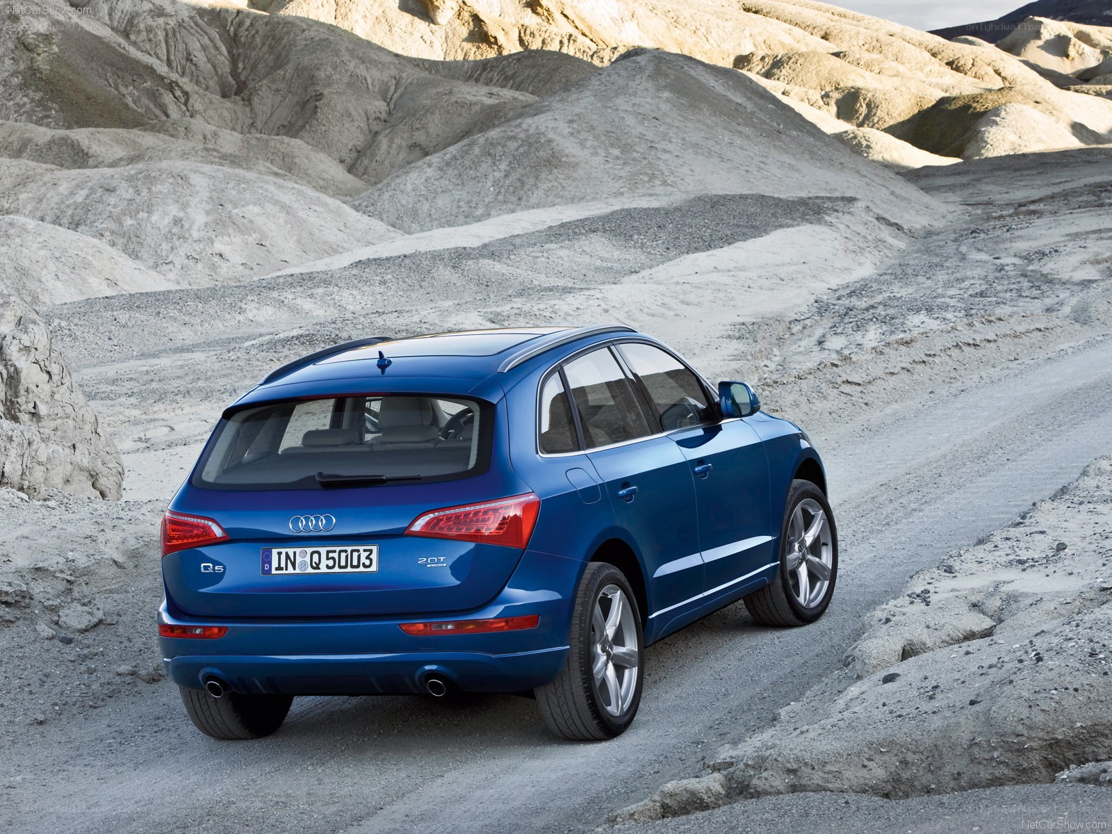 Blue Audi Q5 in desert landscape