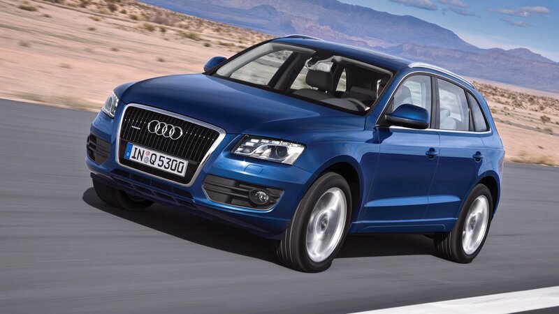 Blue Audi Q5 on desert road