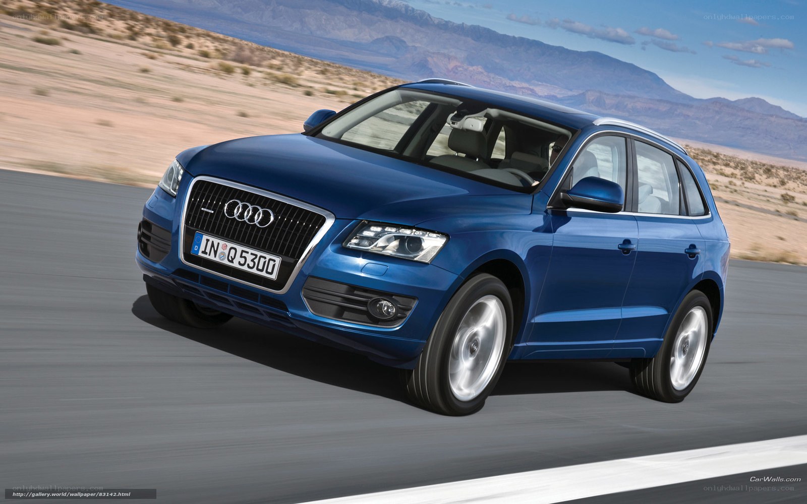 Blue Audi Q5 on desert road