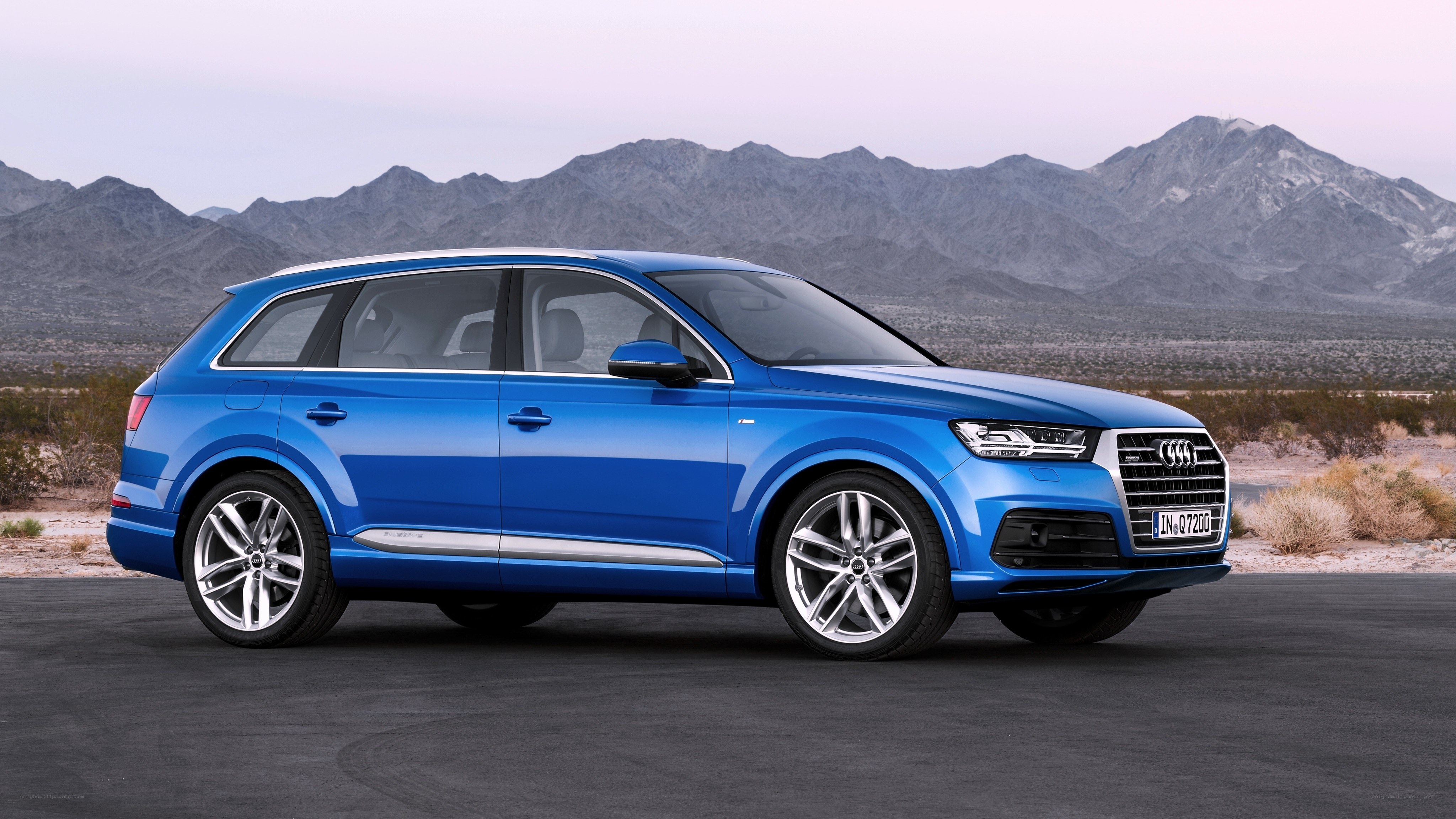 Blue Audi Q7 in desert