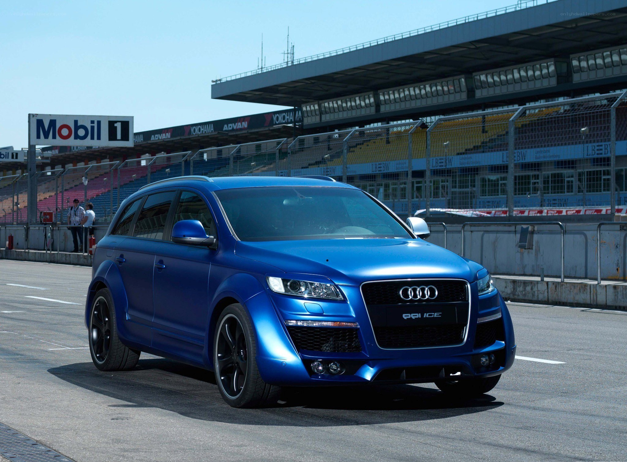 Blue Audi Q7 on a racetrack