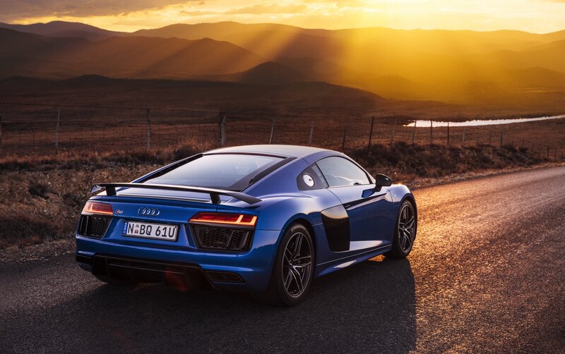 Blue Audi R8 at sunset