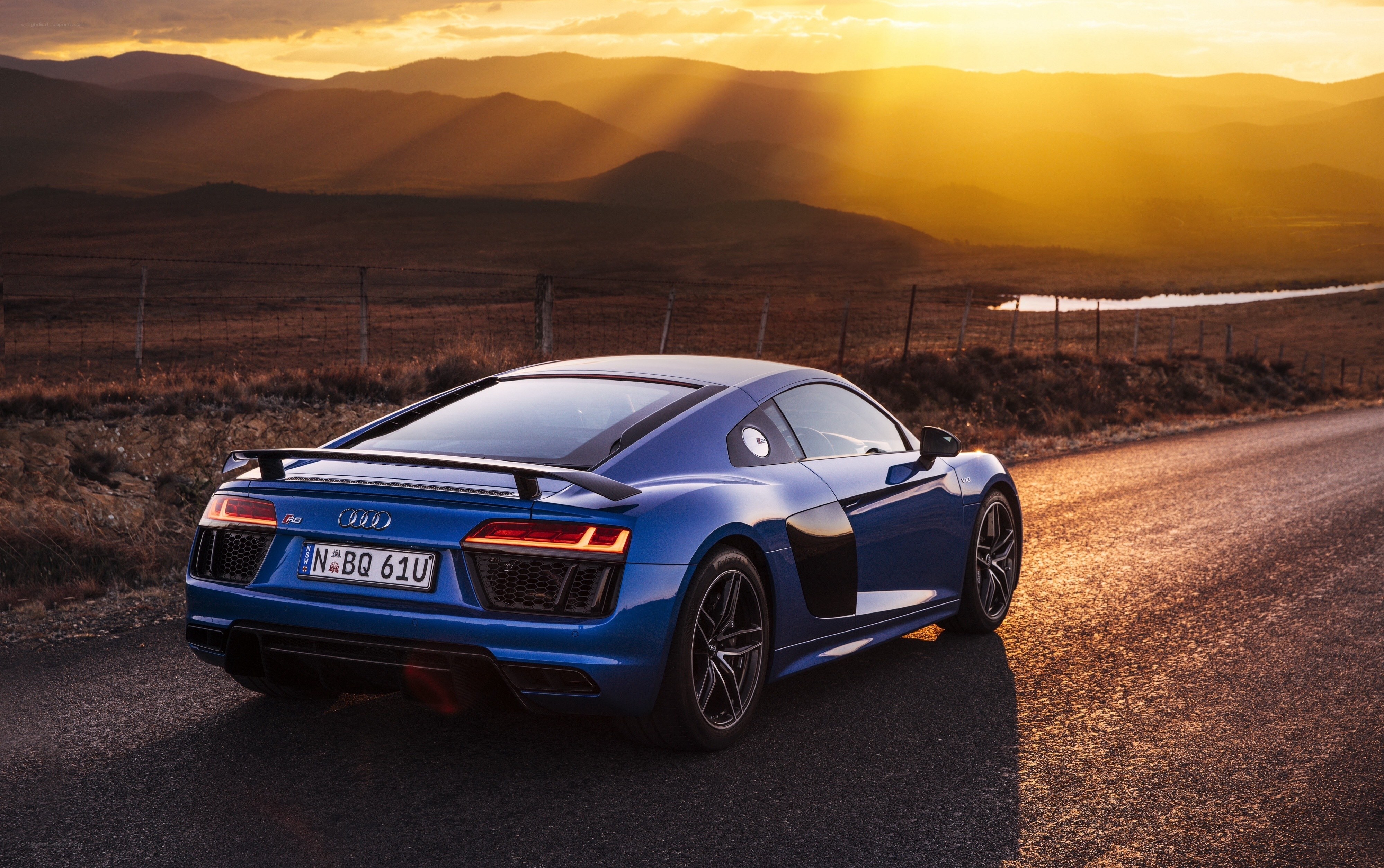 Blue Audi R8 at sunset