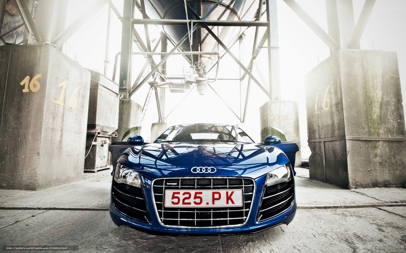 Blue Audi R8 in industrial setting